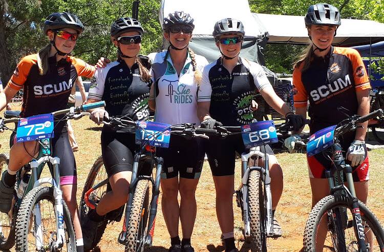 Lynne Vaughan (centre) and her friends from South Coast United Mountain Bikers (SCUM). Photo: Supplied