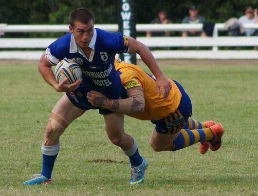 Rixon Russell attempts to break a tackle during the 2013 grand final at the Nowra Showground. Photo: Game Face Photography