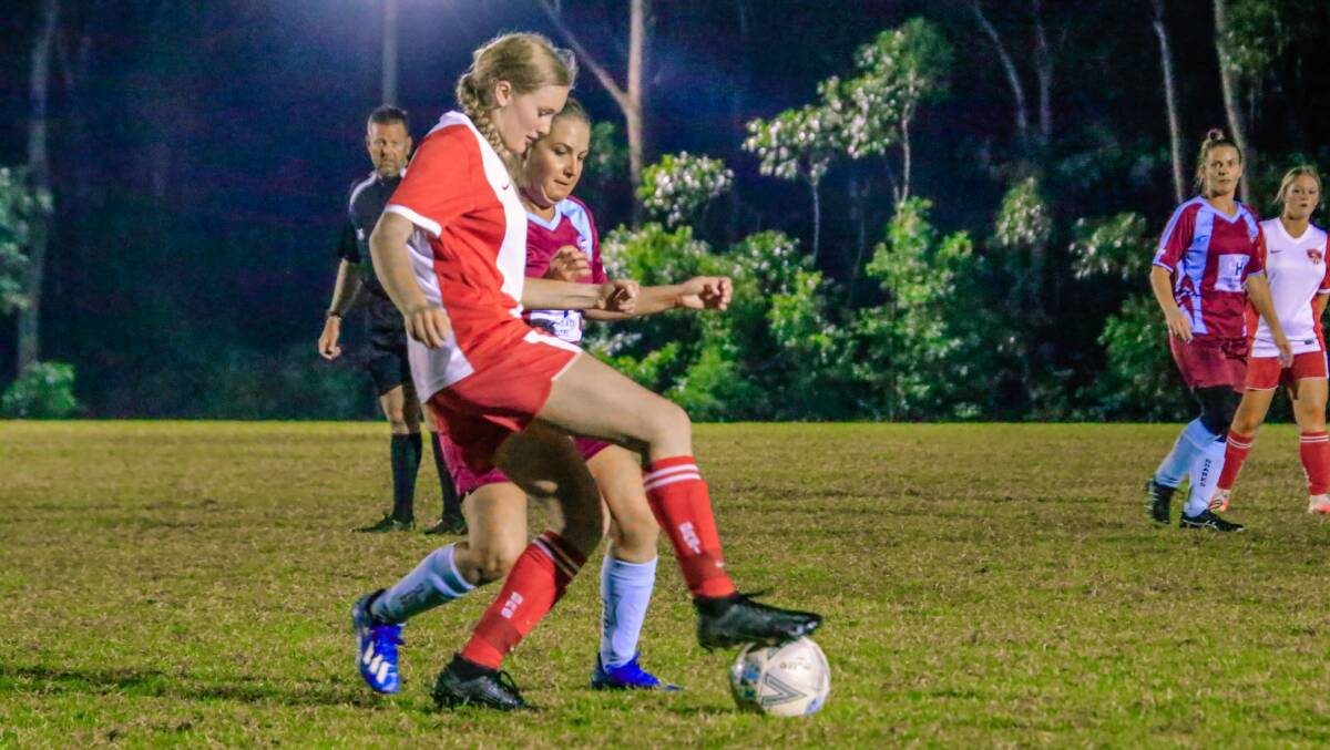 St Georges Basin's Lucy Brown controls the ball despite pressure from a Shoalhaven Heads-Berry opponent. Photo: Tamara Lee