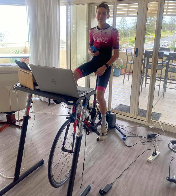 You can't stop the music: A cyclist ready to start an intense training session on Zwift. Nowra Velo Club members continue to train and race using online apps.
