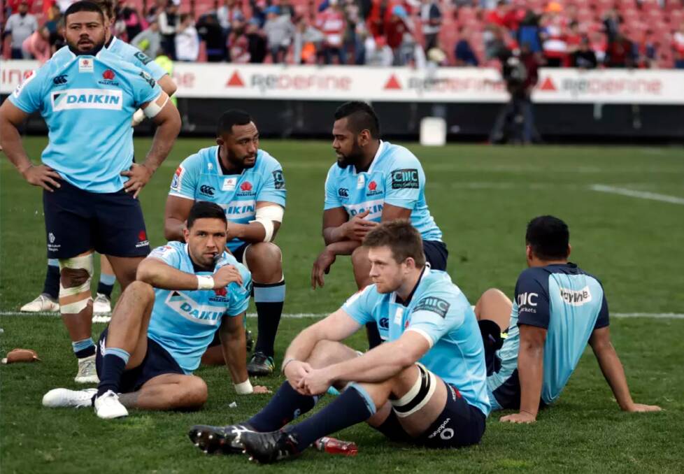 Dejected Waratahs players after losing to the Lions. Photo: AP