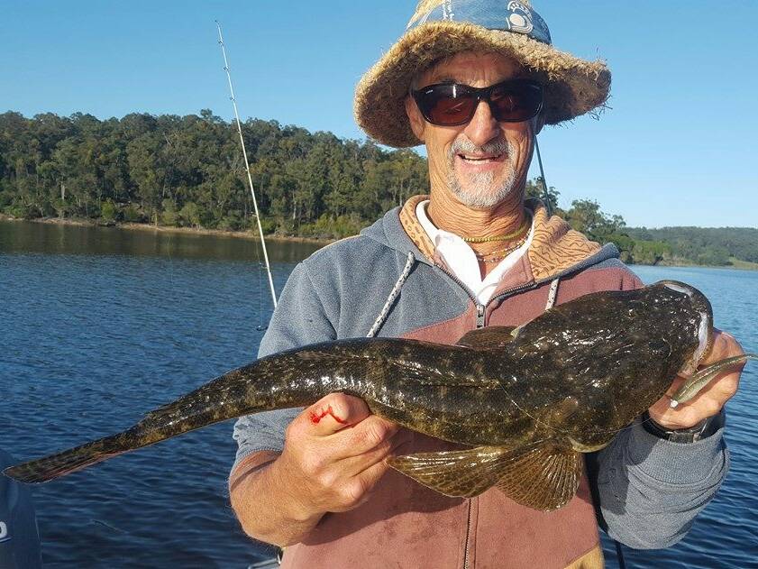 SOLID SOUTH COAST CATCH:  Fishing guru Mark "Hippie" Carradus and another flathead he managed to get his hands on from Wallaga Lake. 