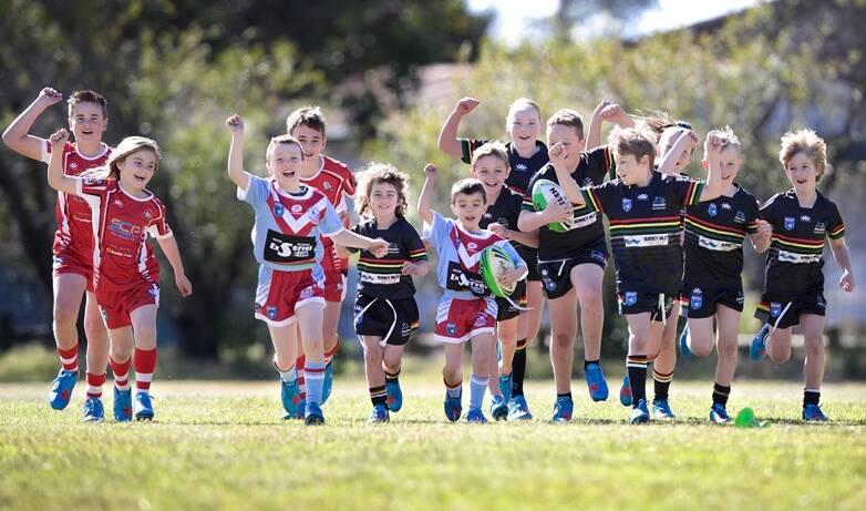 Players from St Georges Basin, Milton-Ulladulla and Sussex Inlet junior rugby league clubs with their new boots. Photo: NSWRL