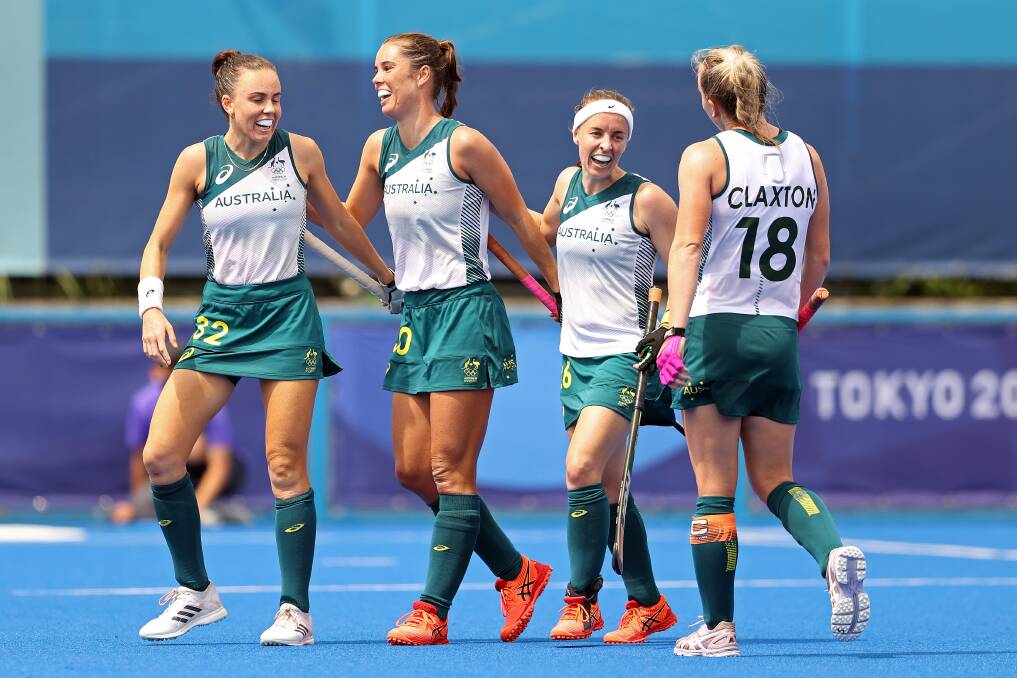Gerringong's Grace Stewart (second from left) and her Hockeyroos teammates celebrate a goal against China on Monday. Photo: Francois Nel