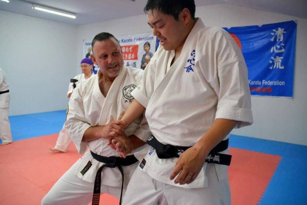 Darren Lee (left) has been involved in mixed martial arts for 46 years. Photo: Supplied