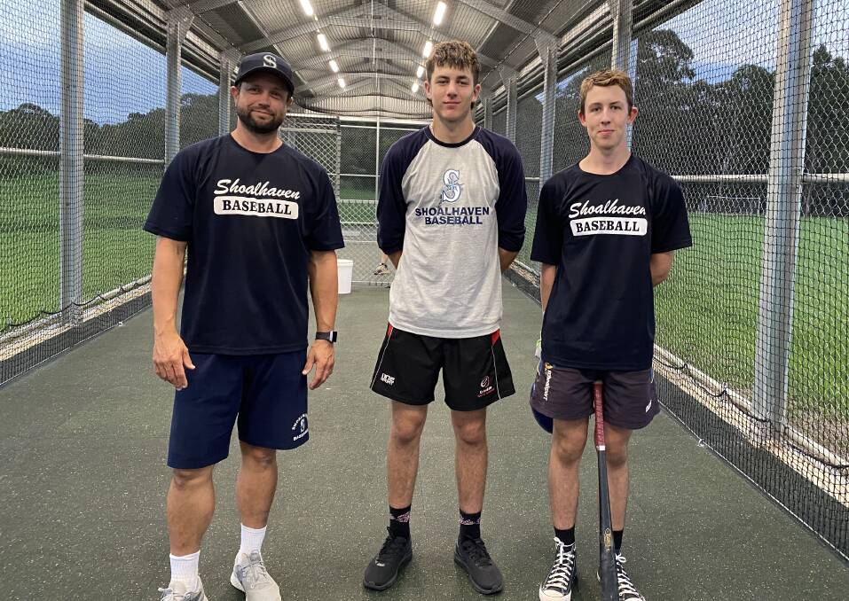 Shoalhaven Mariners second grade coach Gabe Tate with the club's new ACT players Will Page-Allen and Darcy Franks in the batting cage as it lights up for use. Photo: Supplied