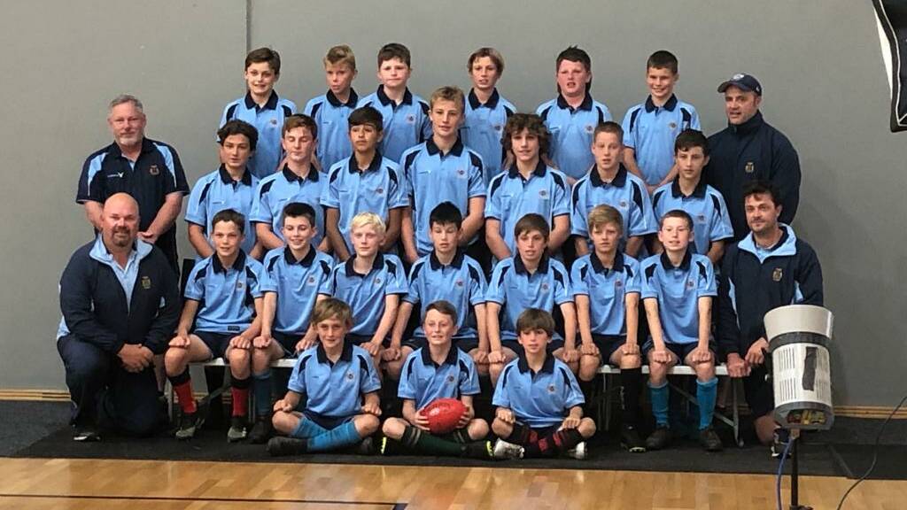 CJ Malmborg (middle row, fifth from left) and his NSW PSSA boys AFL side. Photo: Supplied