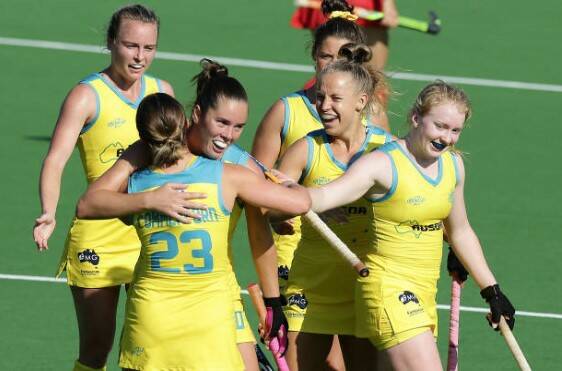 Kalindi Commerford, Grace Stewart and their Hockeyroos celebrate a goal in a recent match. Photo: HOCKEY AUSTRALIA