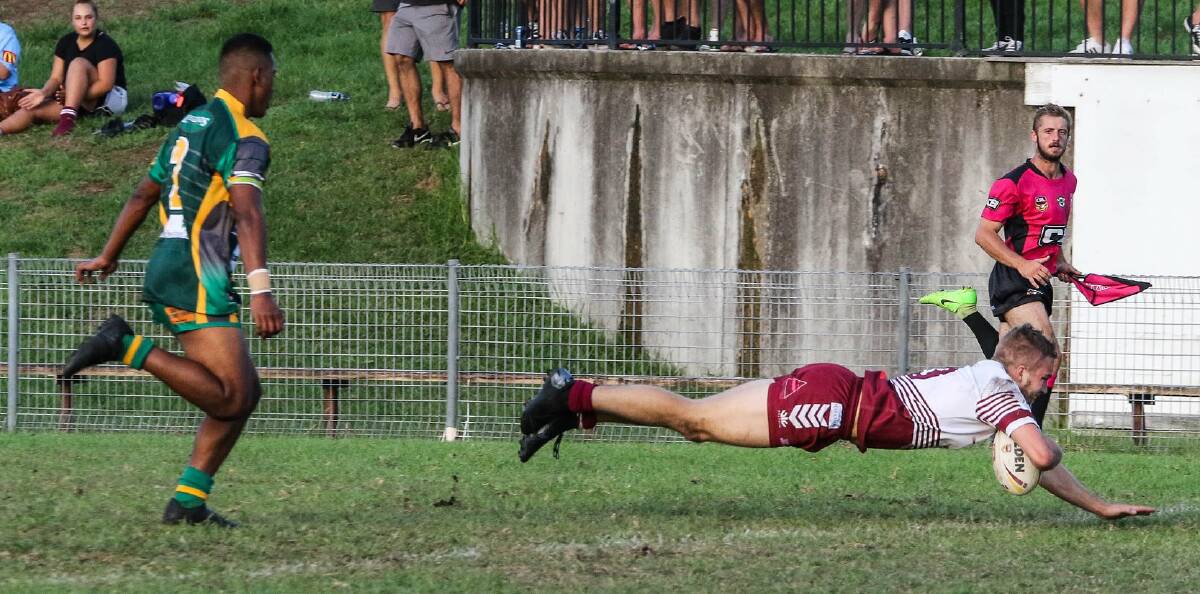 Eagles' Blake Jones dives over to score the match's opening try. Photo: MARGO JANE
