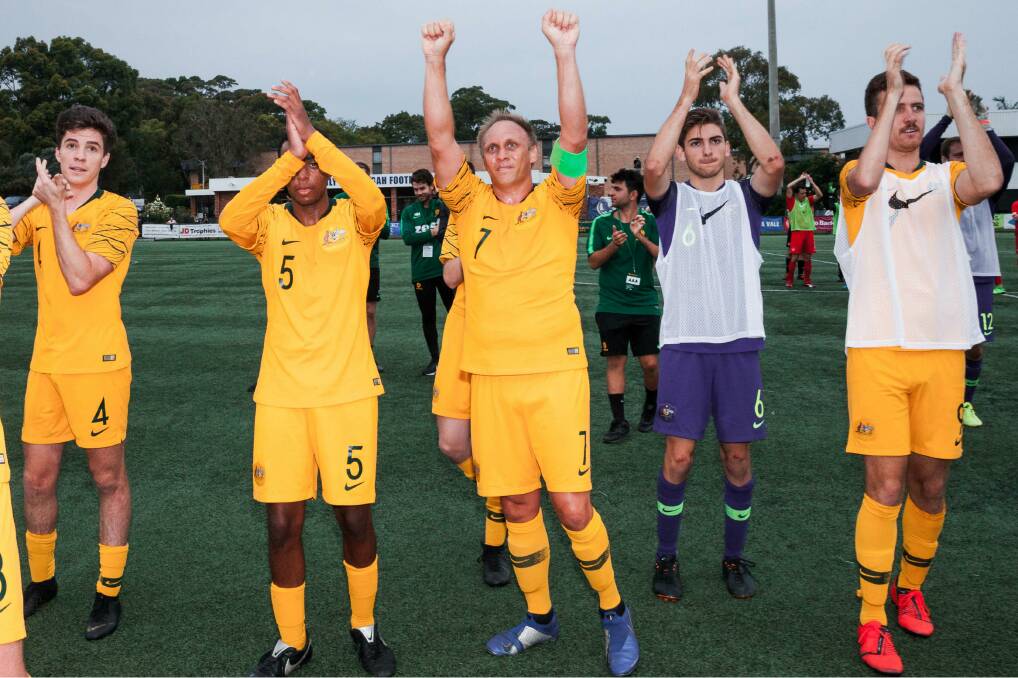 Ben Atkins (right) and his teammates thank the fans after their recent 5-nil win against Canada. Photo: FFA