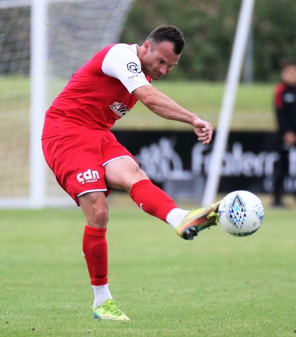 Milton-Ulladulla's Chris Price passes to a Wollongong Wolves teammate during a match against Sydney United 58 this season. Photo: Pedro Garcia Photography
