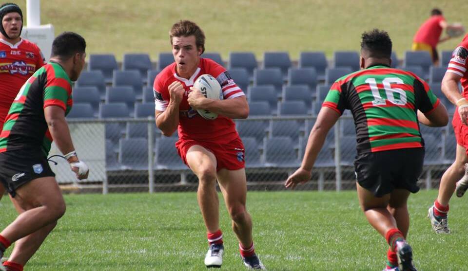 Jackson Ford takes a hit-up for the Illawarra Steelers during his junior years. Photo: ALLAN BARRY