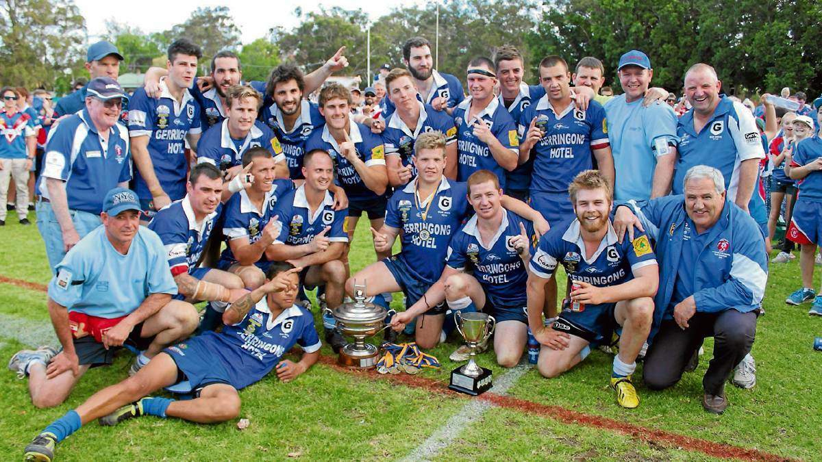 Scott Stewart (back left), Michael Cronin (front right) and the Lions after their 2013 premiership. Photo: David Hall