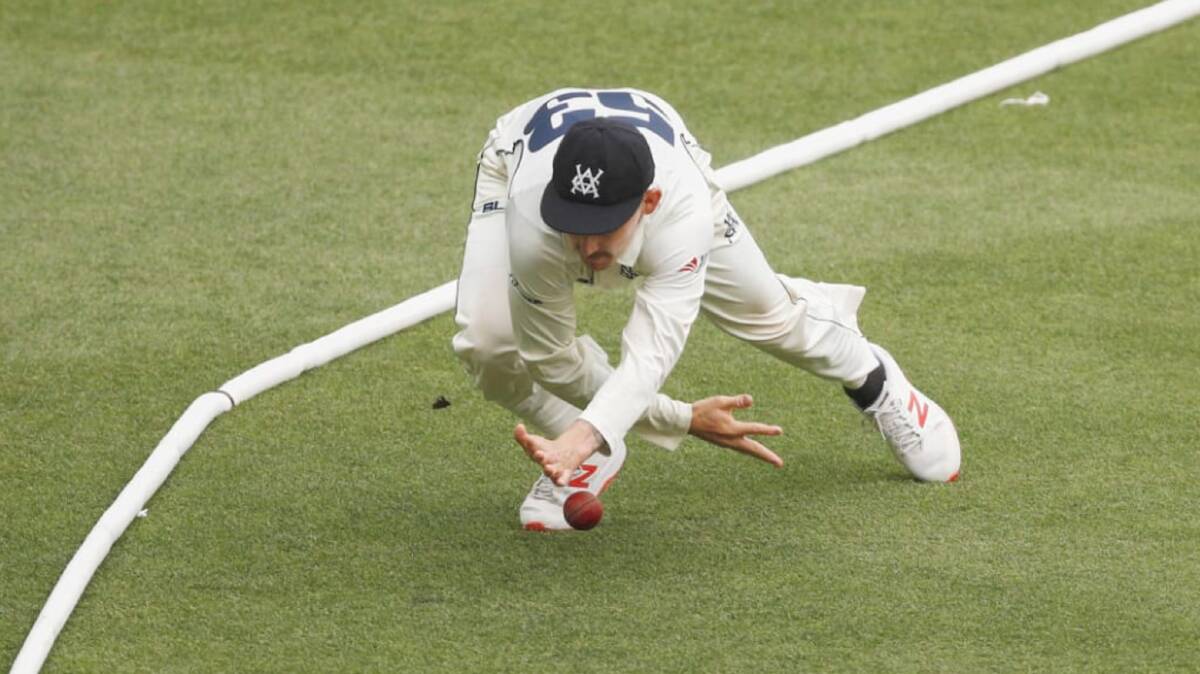Nowra's Nic Maddinson of Victoria attempts to keep the ball in play on day two of the round 6 Sheffield Shield match against Western Australia. Photo: AAP