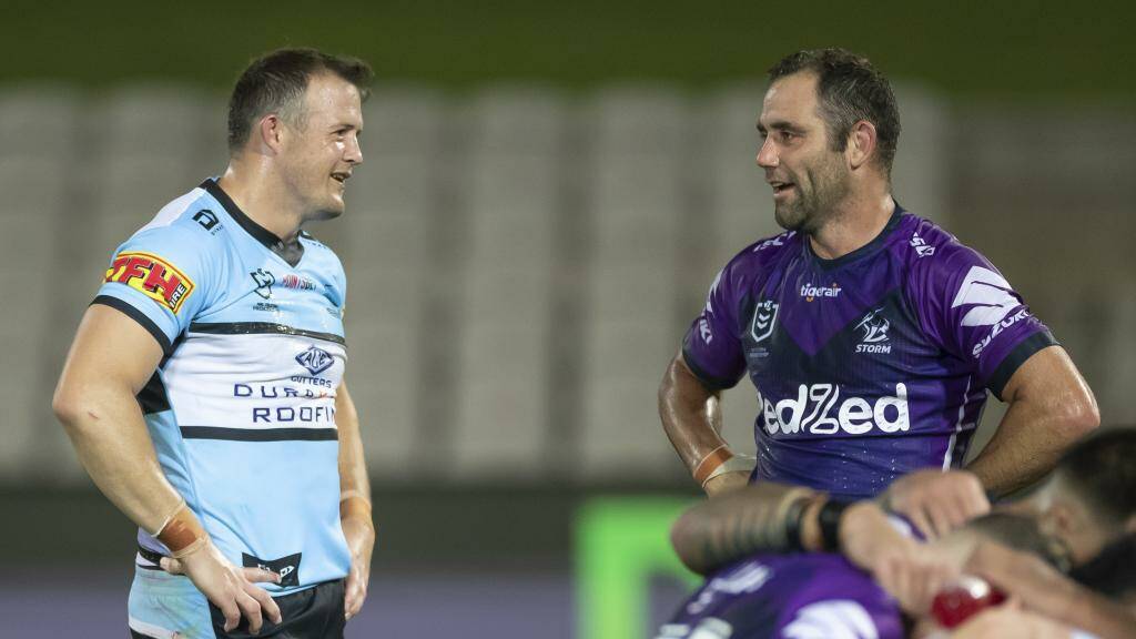 Cronulla-Sutherland's Josh Morris chats with Melbourne skipper Cameron Smith after Saturday's match. Photo: SHARKS MEDIA