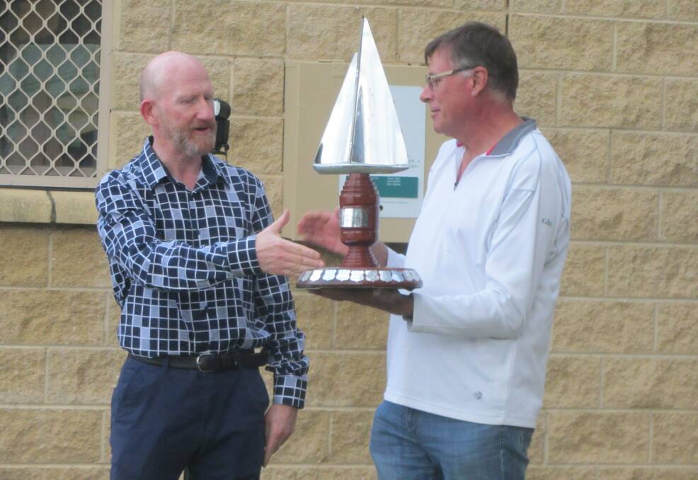 Well sailed, sir: Captain Warren Bairstow of HMAS Creswell and JBCYC Commodore David Churchward shake hands as the Creswell Cup for 2019 is declared.