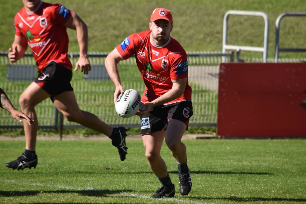 Adam Clune gets a pass away during a recent St George Illawarra training session. Photo: Dragons Media