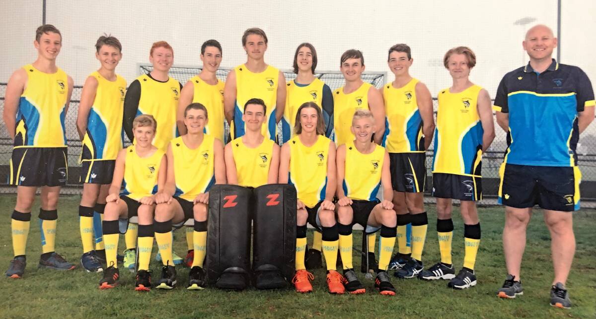 Sam Wright-Smith (back row, third from left), Scott Crisafi (back row, fourth from left) and their South Coast hockey team.