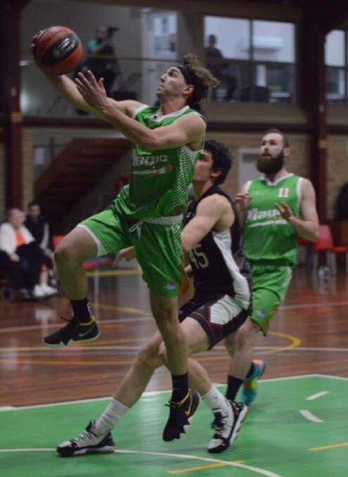 Moss Vale's Brayden Morris goes up for a lay-up on Saturday. Photo: Roz Wellington