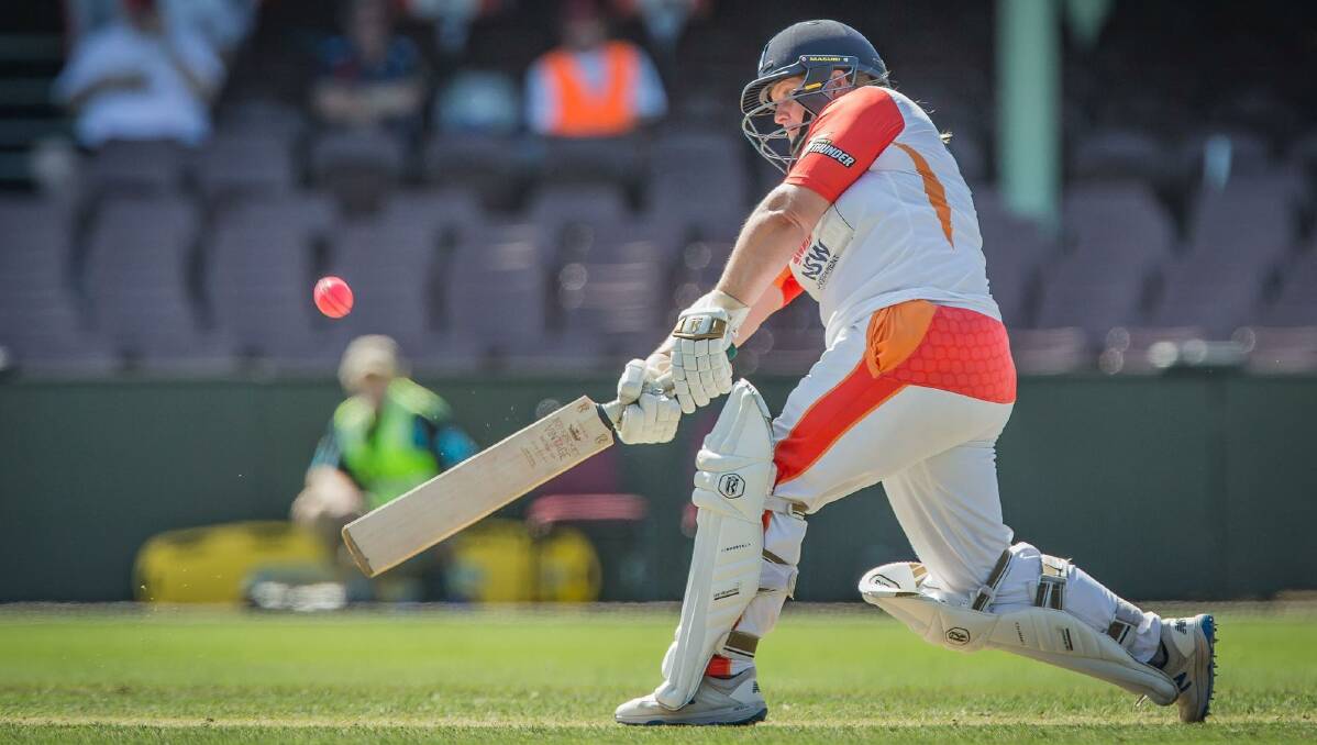 Illawarra Flames' Joanne Kelly smashes a ball back over the bowlers head at the SCG in January. Photo: Benjamin Churcher