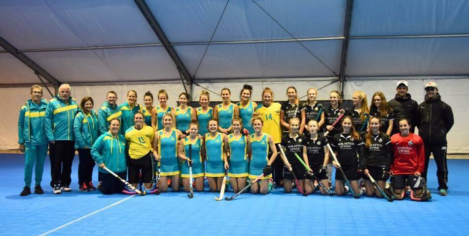 INTERNATIONAL STAR: Shoalhaven Heads' Kyah Gray and her Australian women’s indoor hockey team with a club team they played against from Belgium. 