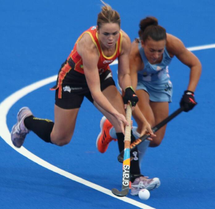 Kalindi Commerford attempts to win possession for the Hockeyroos against Argentina. Photo: SHANE PAUL