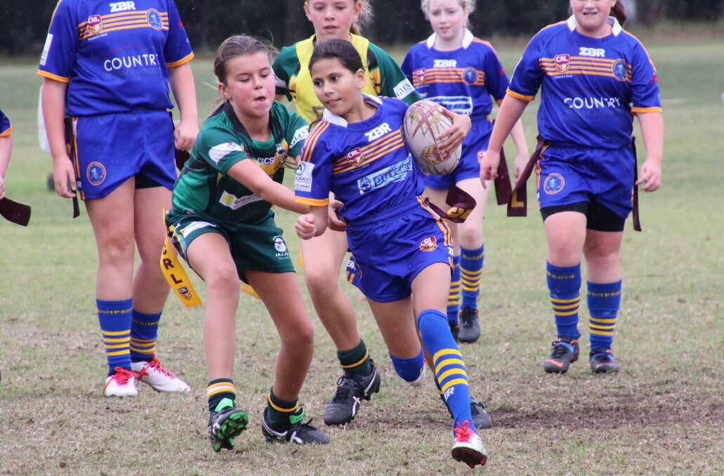 BOLD MOVE: Bomaderry under 12s girls league tag player Amelia Barkat-Jarrett surges forward for her team on the weekend.