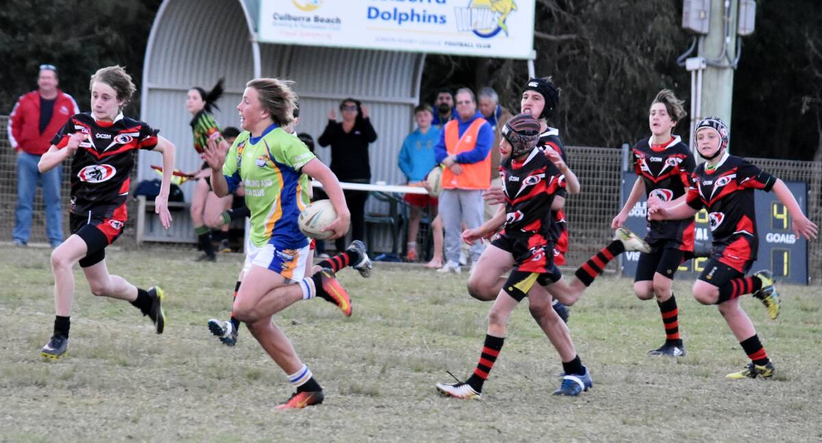 Breakout: Culburra Dolphins under 13s Sam Colgate leaves the Collies defence in his wake as he races upfield. Photo: JAKKI HAYDOCK