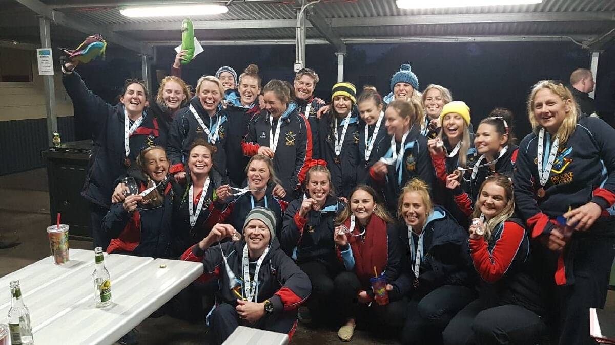 Daniel Knapp (front) and his ADF women's side after a recent Australian Country Championship.