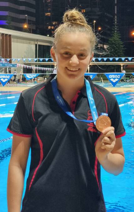 Talika Irvine with her 14 year girls 400 mete individual medley bronze medal. Photo: Supplied
