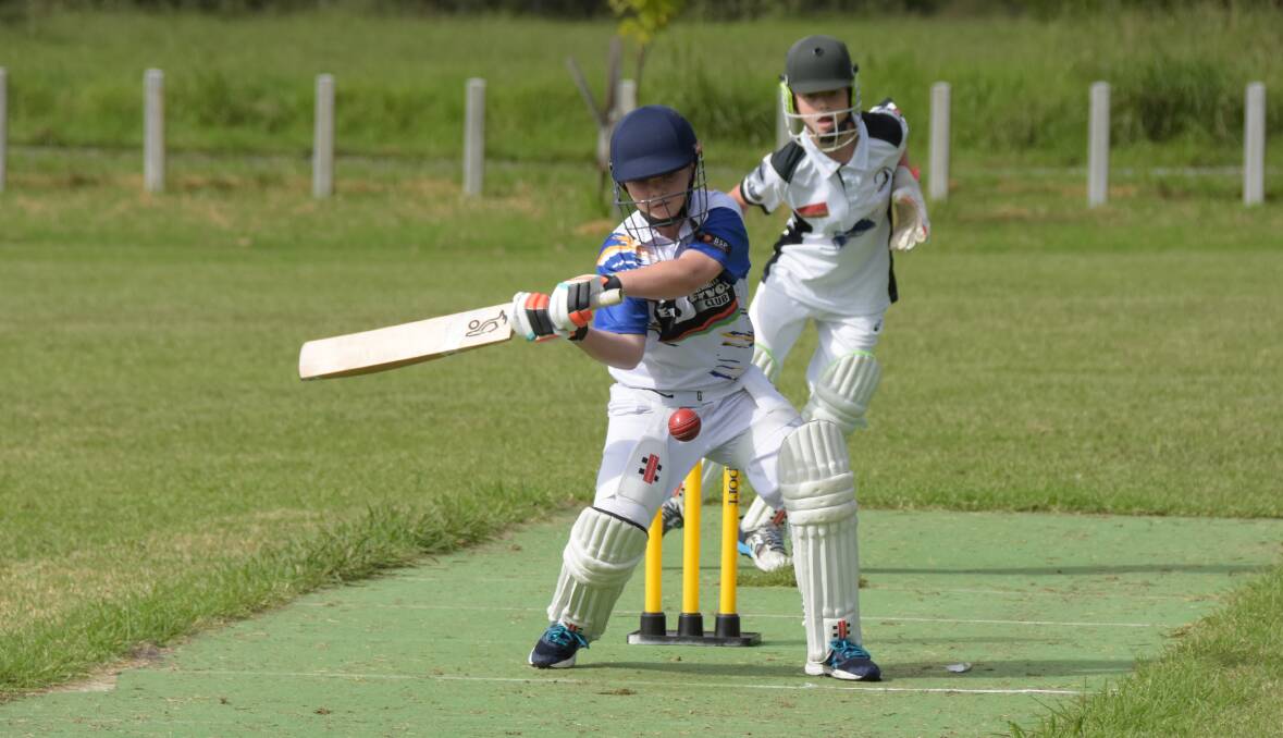 Ulladulla United's Deklen Barford sets himself for a shot as Berry-Shoalhaven Heads wicketkeeper Noah Hinkley watches on. Photo: Courtney Ward