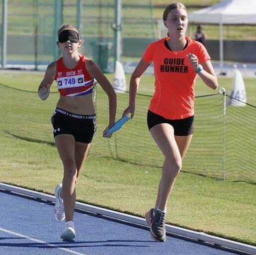 WINNING COMBINATION: Karlee Symonds and her guide Victoria Kennedy, who have ran together on and off for five years, on their way to winning the 800m. Photo: ATHLETICS NSW