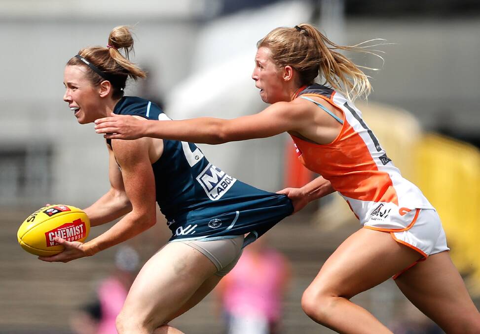 GWS' Maddy Collier (right) attempts to tackle a Carlton opponent last season. Photo: AFL MEDIA