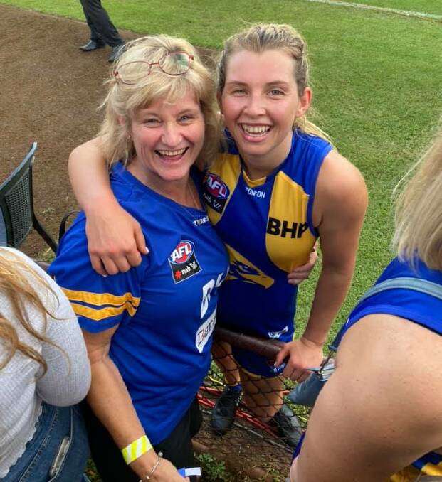 Maddy Collier (right) celebrates the Eagles win with her mother Carole. Photo: SUPPLIED