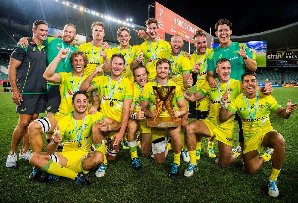 Tom Connor (back row, second from right) and his Australian team celebrate.