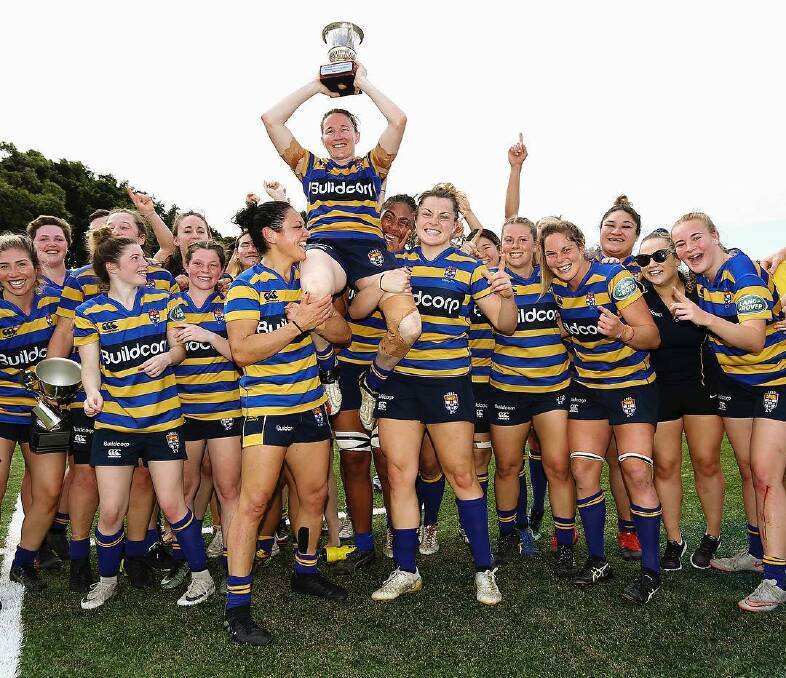 Ash Hewson being held up by her Sydney University team mates after their win. Photo: NSW RUGBY