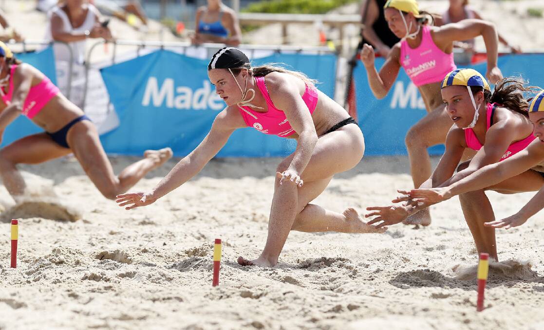 Mollymook's Payton Williams on her way to winning the open women's beach flags at the recent state championships. Photo: DANIEL DANUSER