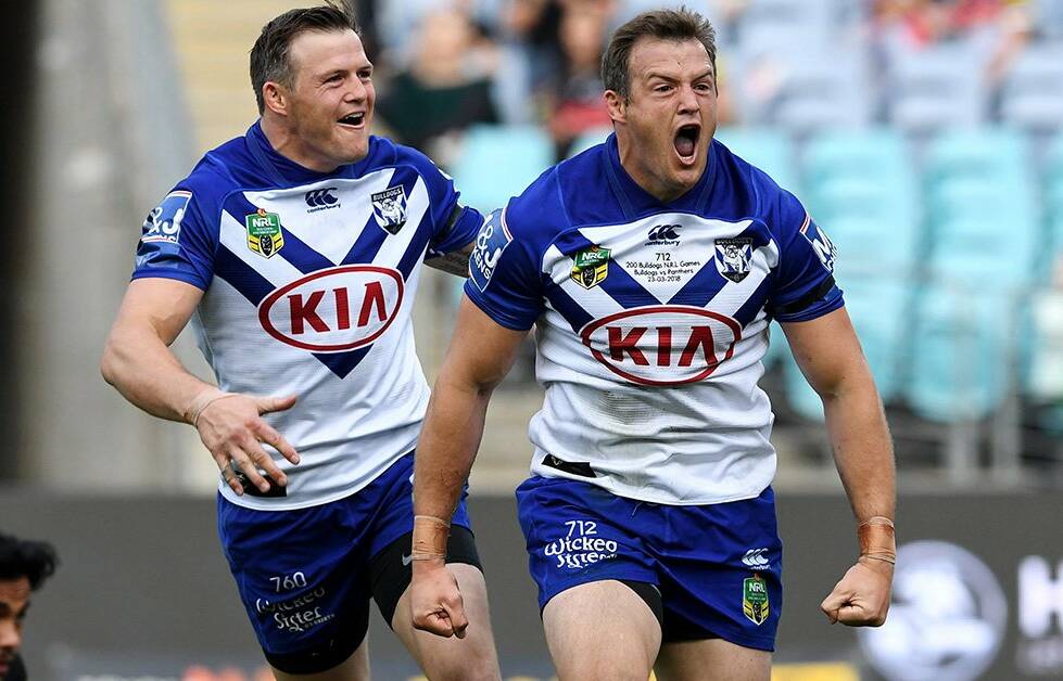 Brett and Josh Morris celebrate a try during their victory against the Panthers. Photo: BULLDOGS MEDIA