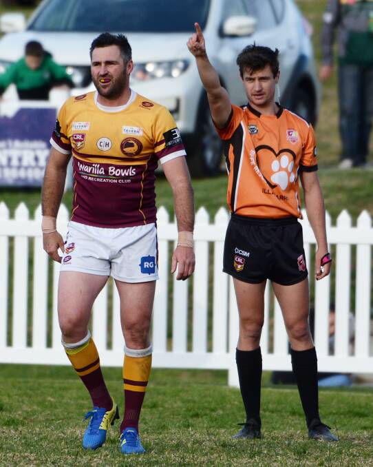 Sharks captain Matt Carroll is sent-off by referee Michael Booth during their clash with the Stingrays at Ron Costello Oval. Photo: GREG RIGBY SPORTS PHOTOS