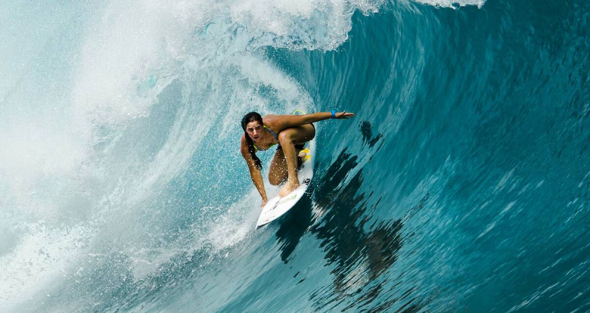 Culburra Beach's Tyler Wright surfs at Tahiti. Photo: Ted Grambeau