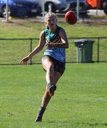 Sophie Phillips kicks the ball to an Eastern Allies team mate. Photo: Dave Pease