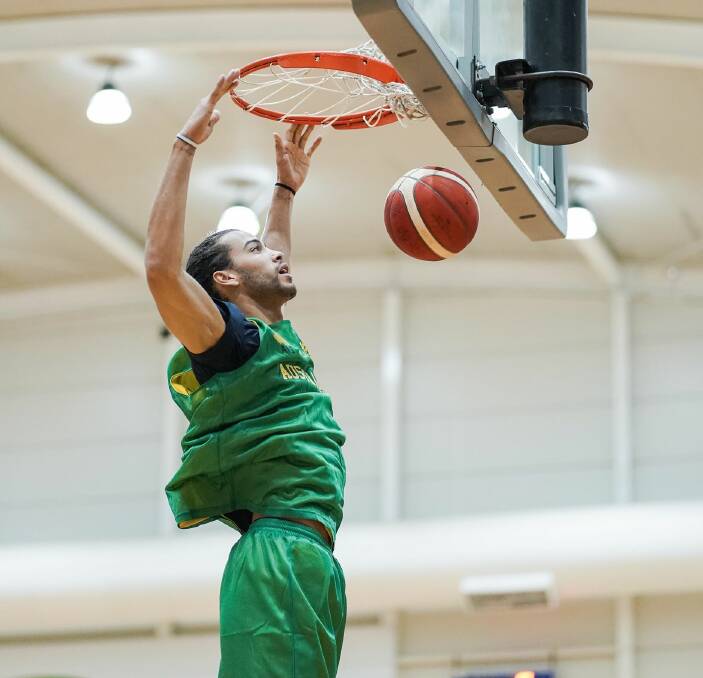 Xavier Cooks dunks during the recent training camp with the Boomers. Photo: BASKETBALL AUSTRALIA