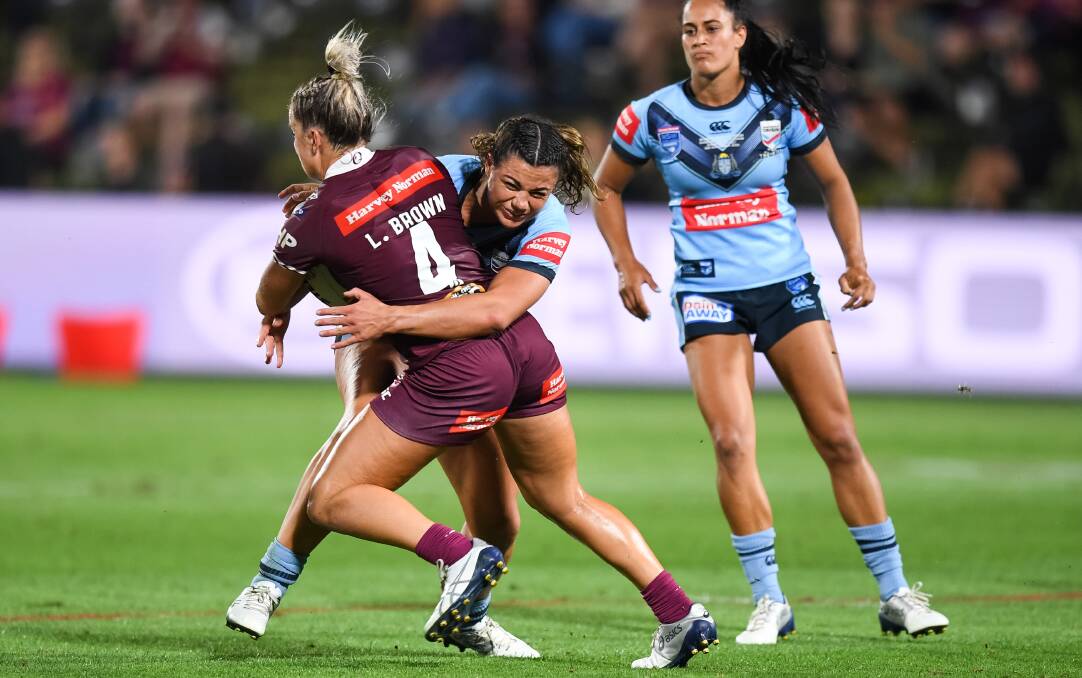 NSW's Millie Boyle tackles Queensland's Lauren Brown. Photo: Nathan Hopkins/NRL Imagery