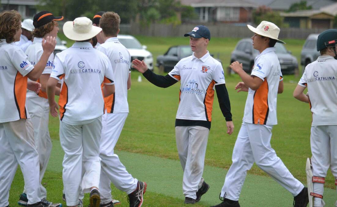 Players from Batemans Bay's stage three side celebrate a wicket during last season division A grand final at Lyrebird Park. Photo: Damian McGill