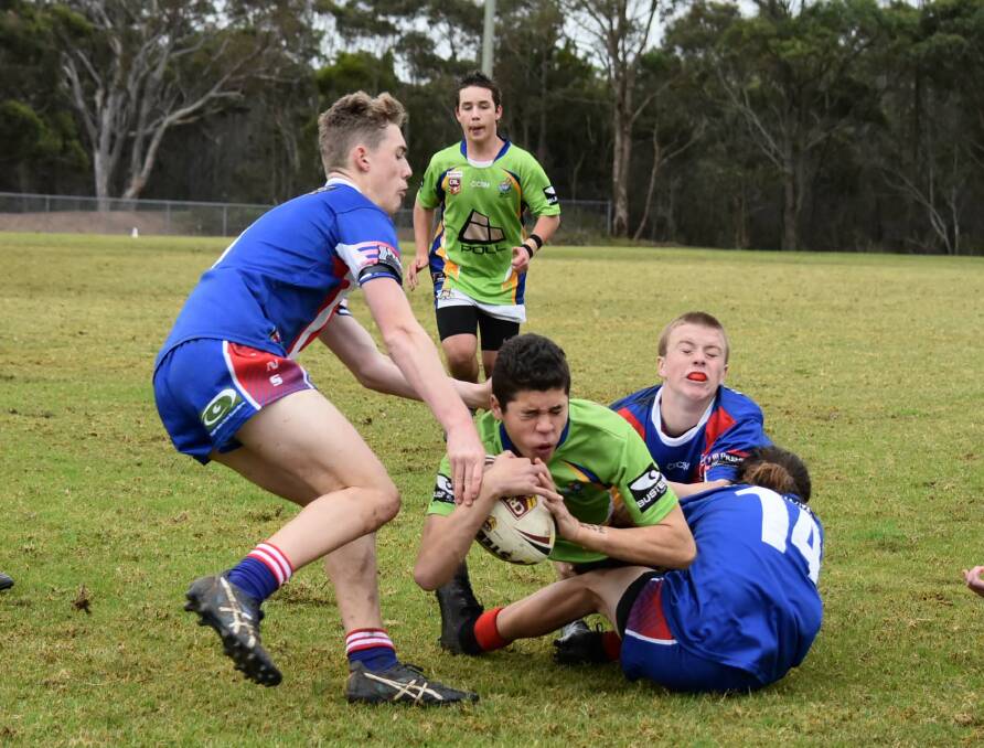 SLIPPERY: The Under 16s played host to Gerringong in wet conditions. Dolphins' player Dallas Riley-Burns pushes forward. Photo: JAKKI HAYDOCK