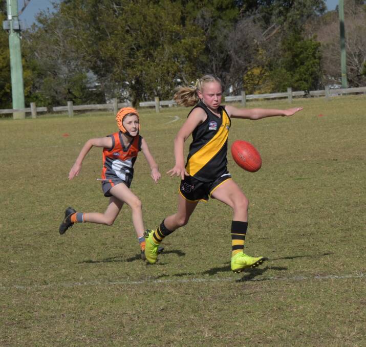 Shoalhaven Giants' Ripley Thornett chases down Bomaderry Tigers' Hannah Phillips. Photo: COURTNEY WARD