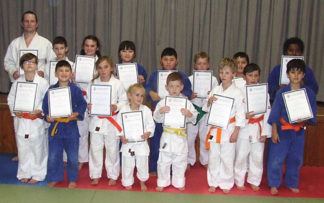 Hard work rewarded: Some of the successful Bushido Judo Club Shoalhaven members proudly display their grading certificates.
