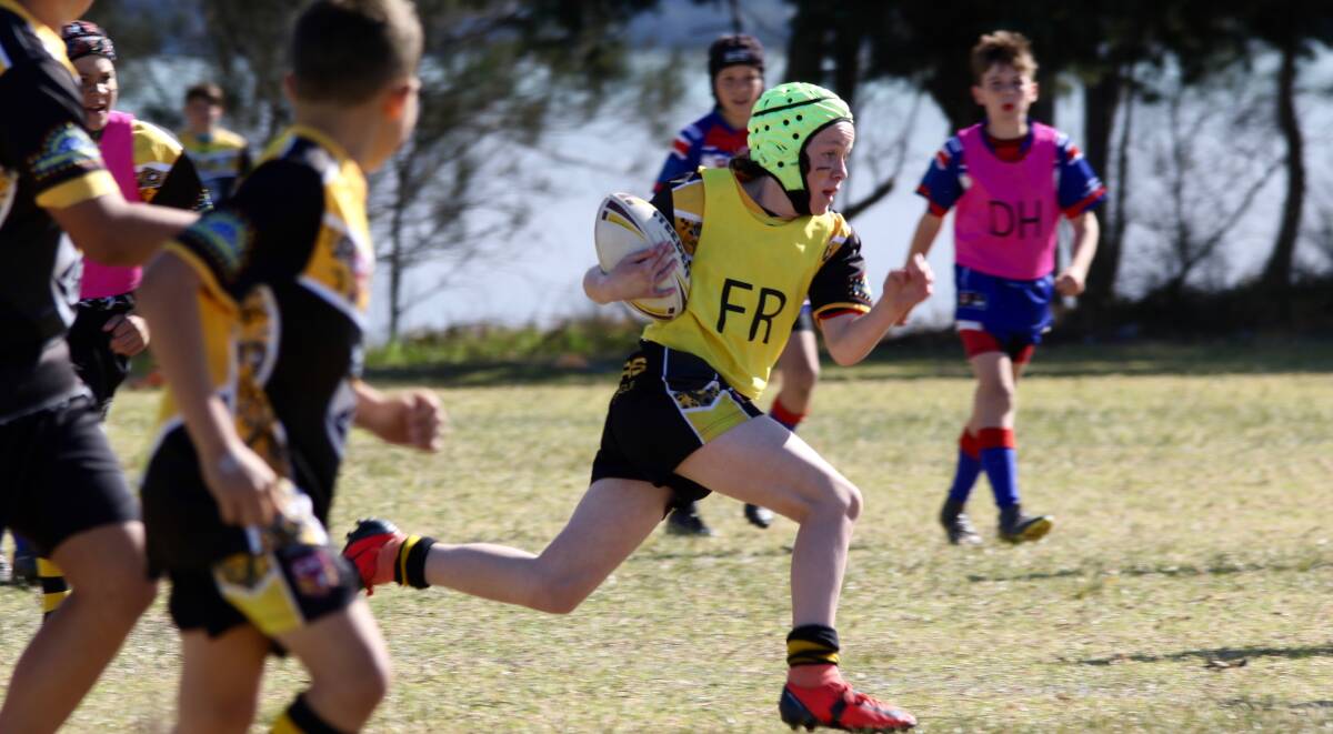 Under 13 Nowra Warrior Nate Stewart leading the way during the 2019 grand final.