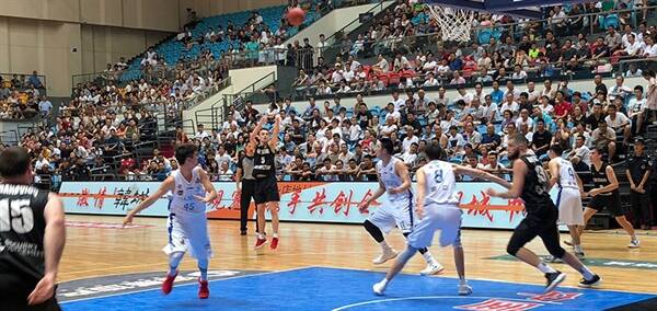 James Hunter (13) heads into the paint to try and get a rebound against Jiangsu while playing for the New Zealand Select team. Photo: BASKETBALL NZ