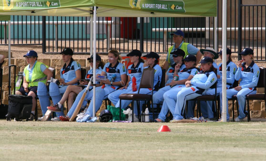 Joanne Kelly (fluro vest at back) and her NSW side at the Australian Country Cricket Championships.
